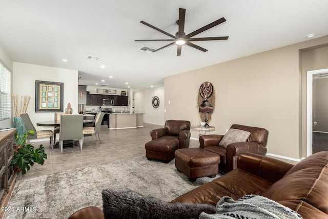 living room featuring visible vents, light tile patterned flooring, a ceiling fan, and recessed lighting