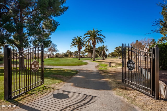 view of gate featuring a yard