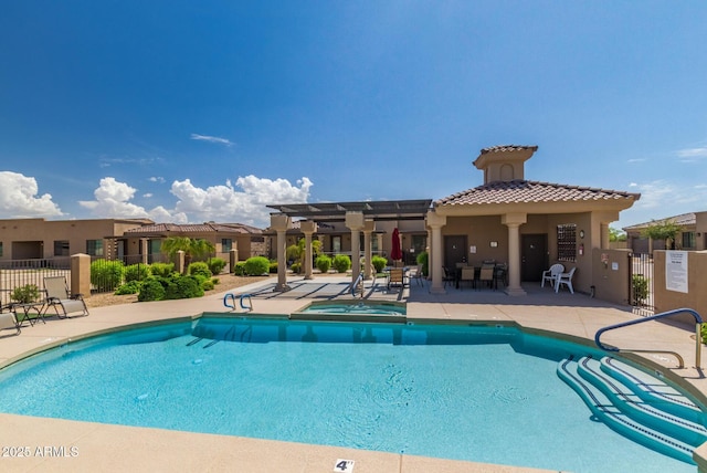 4241 N Pebblecreek Pkwy Unit 7, Goodyear, AZ 85395 - community pool featuring a pergola, a patio area, and a hot tub