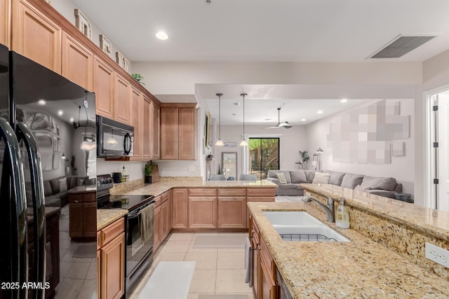 4241 N Pebblecreek Pkwy Unit 7, Goodyear, AZ 85395 - kitchen featuring black appliances, a sink, open floor plan, ceiling fan, and light stone countertops