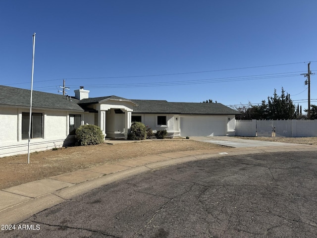 ranch-style home featuring a garage