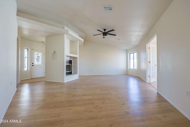 unfurnished living room featuring ceiling fan and light wood-type flooring