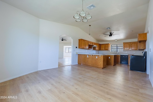 kitchen with sink, black dishwasher, pendant lighting, vaulted ceiling, and light wood-type flooring