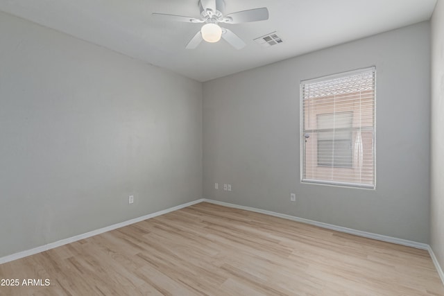 unfurnished room with ceiling fan and light wood-type flooring