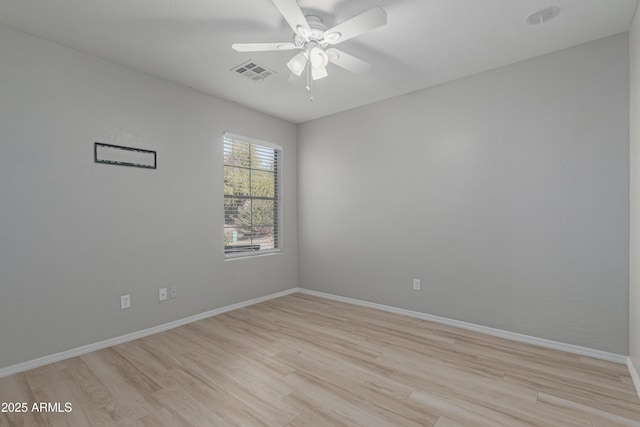 unfurnished room with light wood-type flooring