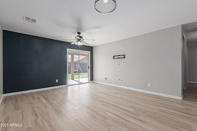 empty room with light hardwood / wood-style flooring and ceiling fan