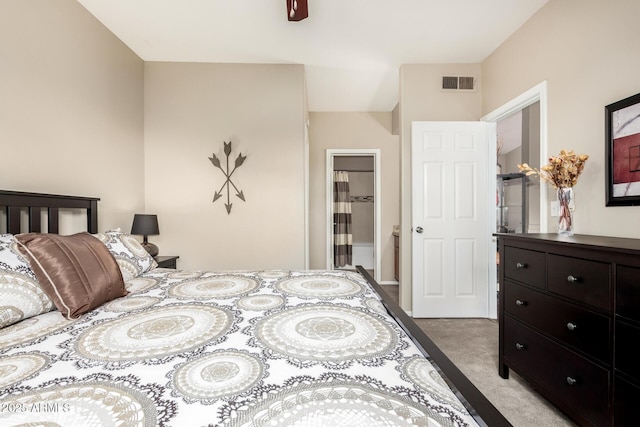 bedroom with light colored carpet and visible vents