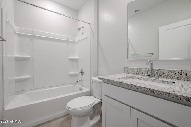 full bathroom with bathtub / shower combination, vanity, and toilet