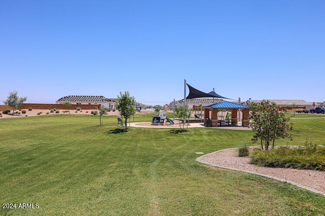 view of yard with a gazebo and a playground