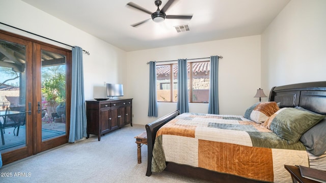 carpeted bedroom featuring multiple windows, access to exterior, and ceiling fan