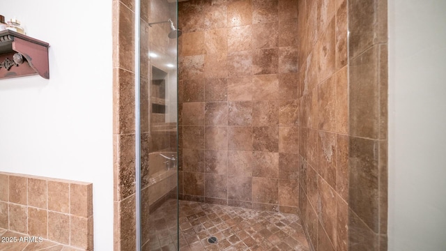 bathroom with tiled shower