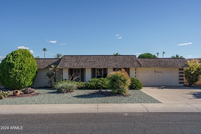 single story home with a garage