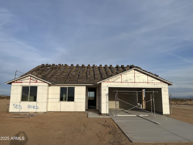 unfinished property with a garage