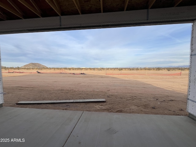 view of yard with a rural view