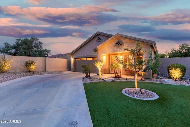single story home with fence, a garage, stucco siding, concrete driveway, and a lawn