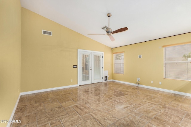empty room featuring a ceiling fan, baseboards, visible vents, and lofted ceiling