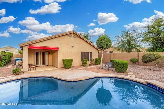 view of pool featuring a patio, a fenced in pool, and a fenced backyard
