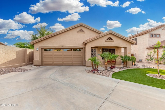 view of front of house with driveway, a front yard, fence, an attached garage, and stucco siding