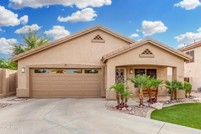 view of front of house with concrete driveway, a garage, and stucco siding