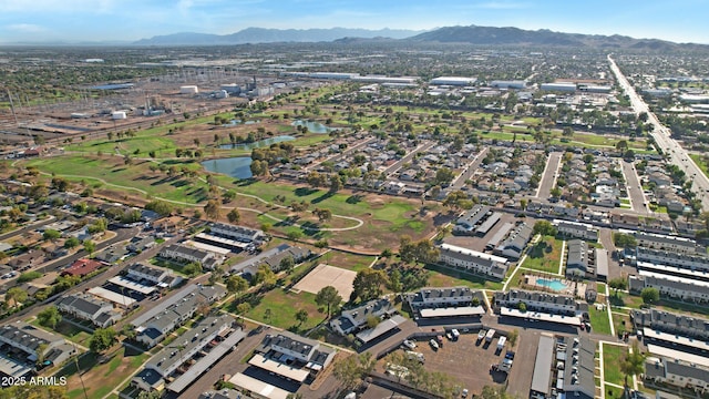 birds eye view of property featuring a mountain view