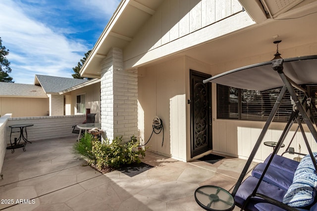 property entrance with a patio