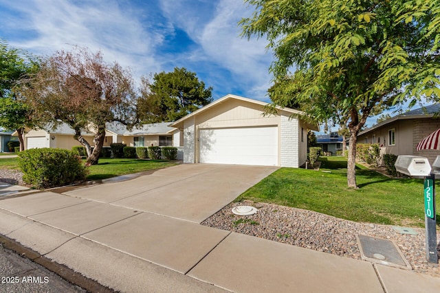 ranch-style home with a garage and a front lawn