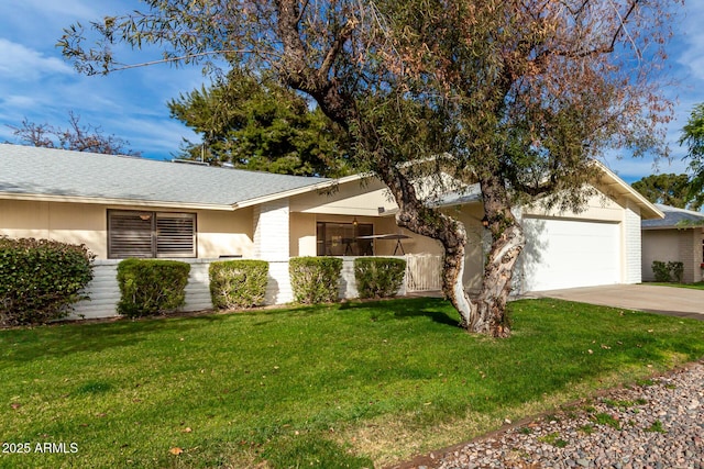 ranch-style house with a garage and a front yard