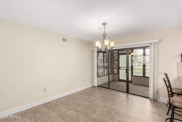 unfurnished dining area with a notable chandelier