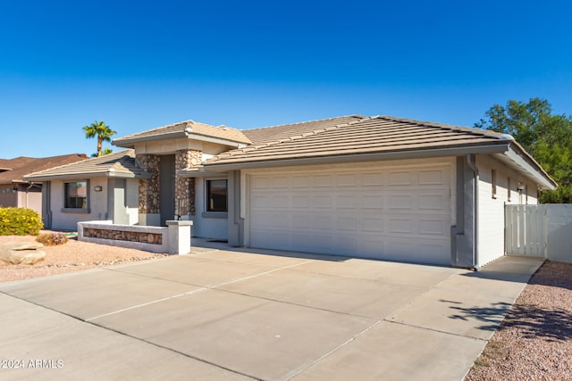 prairie-style house featuring a garage