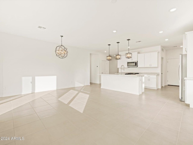 interior space featuring visible vents, light tile patterned floors, recessed lighting, an inviting chandelier, and a sink