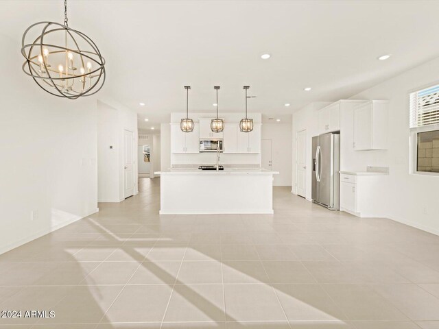 kitchen featuring light countertops, white cabinets, recessed lighting, and stainless steel fridge