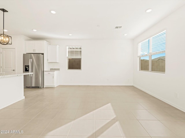 unfurnished room with a chandelier, visible vents, recessed lighting, and baseboards