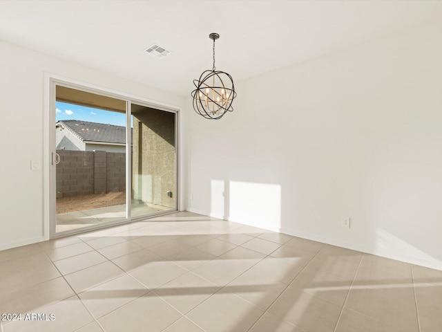 tiled empty room with visible vents and a chandelier