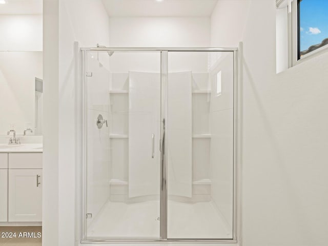 full bathroom featuring vanity and a shower stall