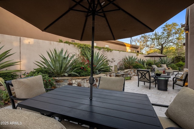 view of patio featuring outdoor dining area