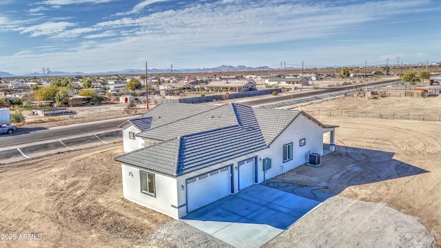 birds eye view of property with a mountain view