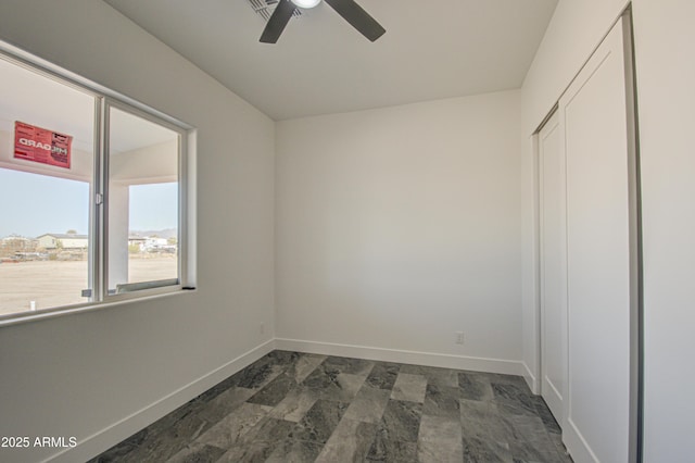 interior space featuring ceiling fan