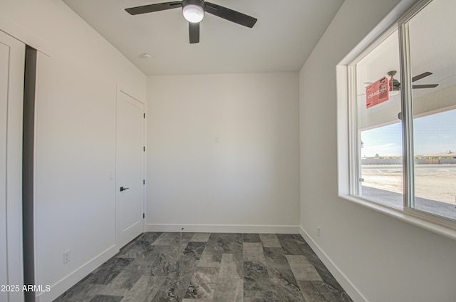 empty room featuring ceiling fan