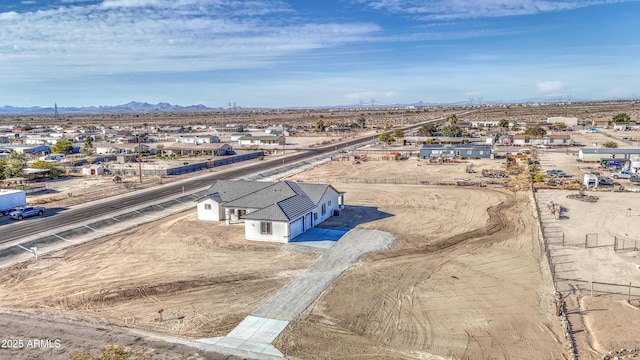 birds eye view of property with a mountain view