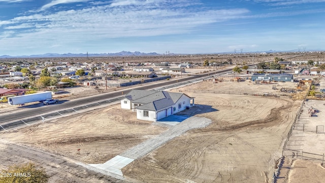 birds eye view of property featuring a mountain view