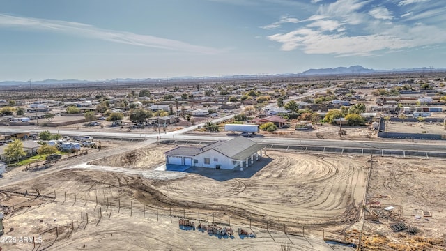 birds eye view of property featuring a mountain view