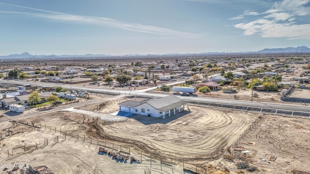 birds eye view of property with a mountain view