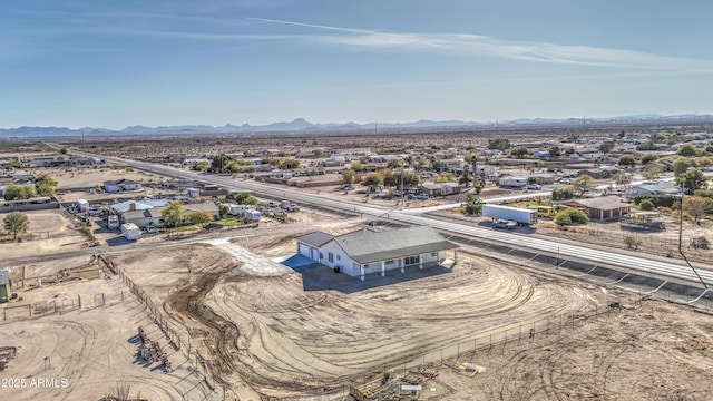 birds eye view of property featuring a mountain view