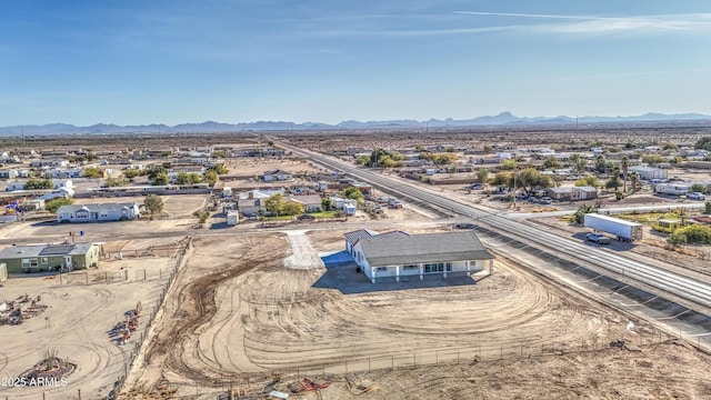 birds eye view of property with a mountain view