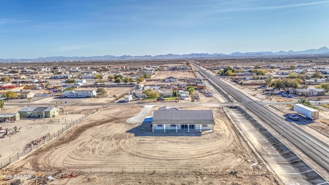 birds eye view of property with a mountain view