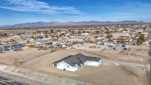 birds eye view of property with a mountain view