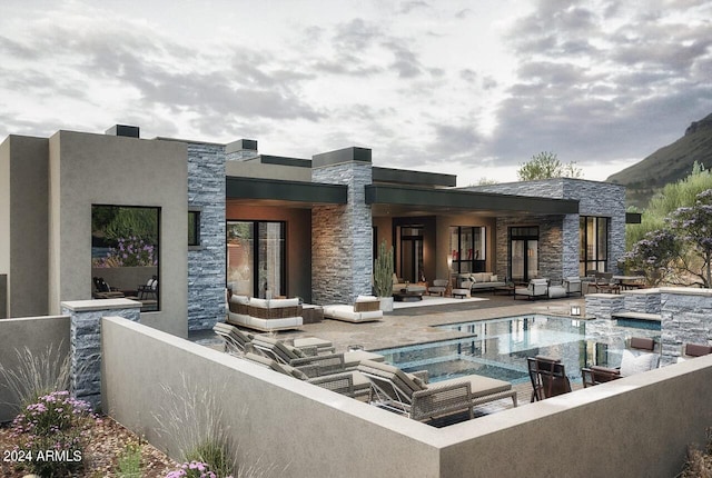 rear view of house with an outdoor hangout area and a patio