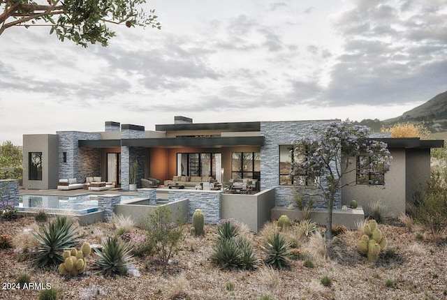 rear view of property featuring an outdoor hangout area and a patio