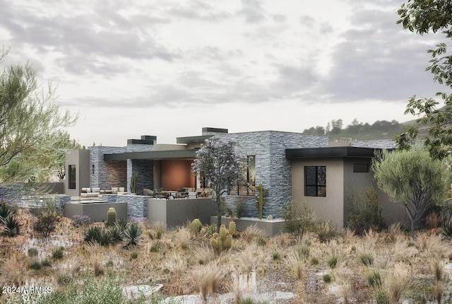 view of front of home with a patio area