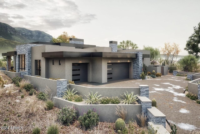 contemporary house featuring a mountain view and a garage